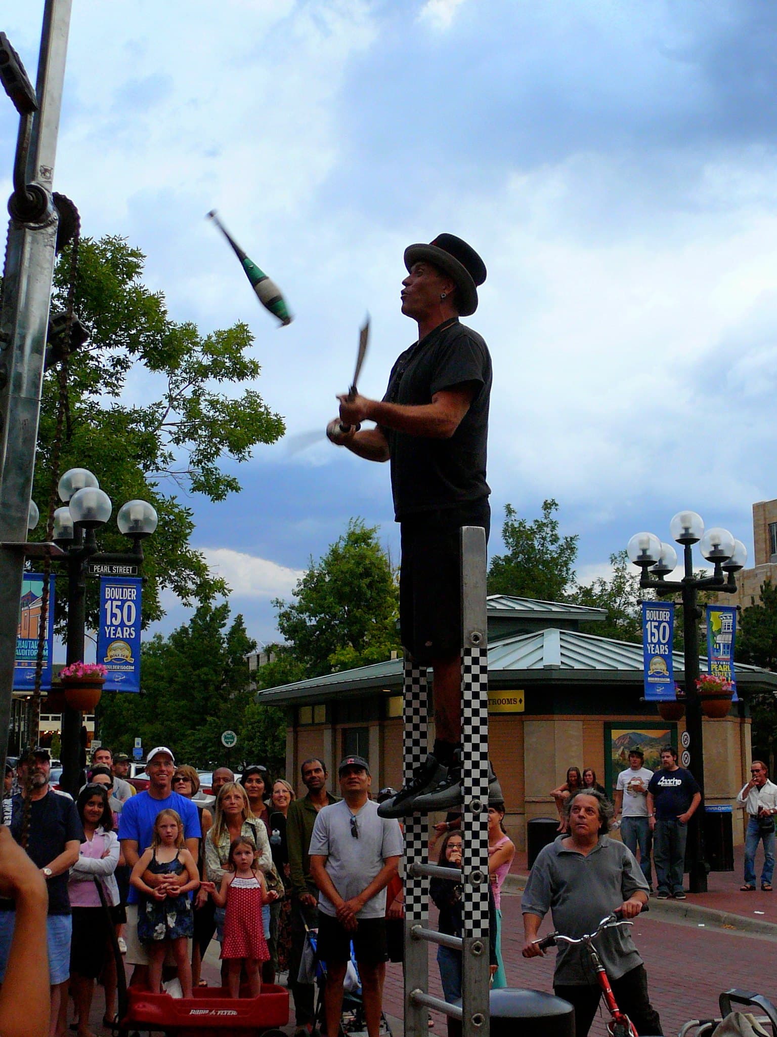 Street Performer at Pearl Street Mall in Boulder, Colorado not far from the campus of CU Boulder. CU Boulder Map provides interactive maps and resources for students and visitors to CU Boulder campus.